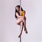 Discover Pole Dance Class - Woman in Orange Pole Dancing